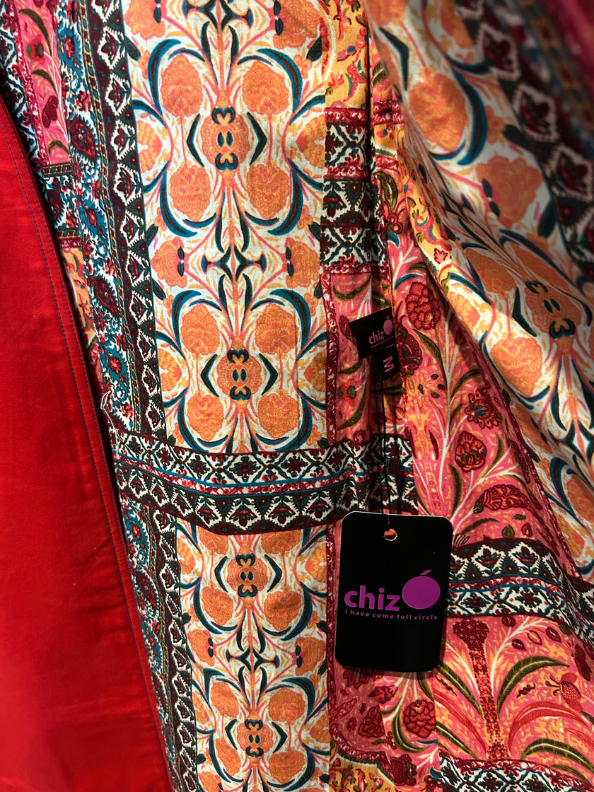 Patterned fabric with a visible brand tag labeled 'chizO' on a red background.